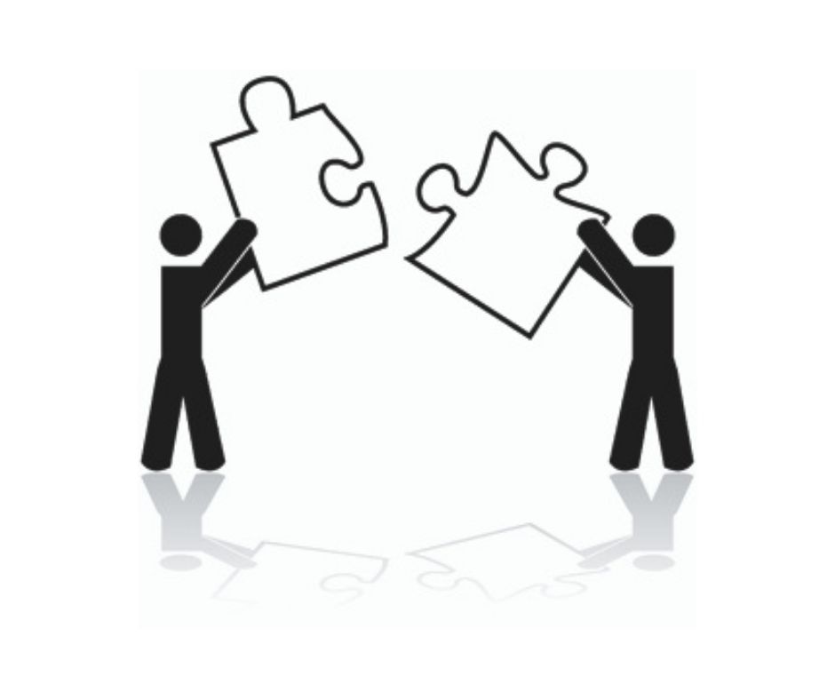 2 person holding connected puzzle piece